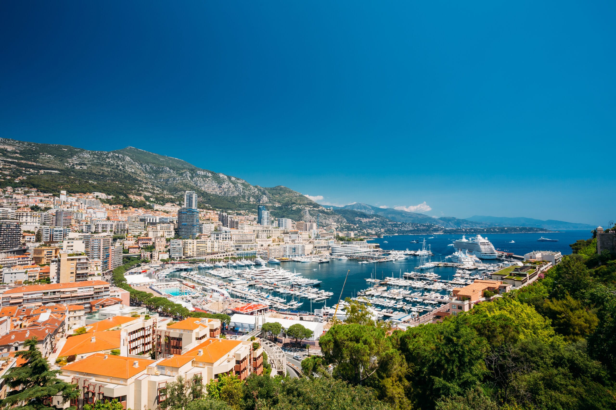 Stunning view of Monaco, with its luxury yachts, historic buildings, and Mediterranean coastline.